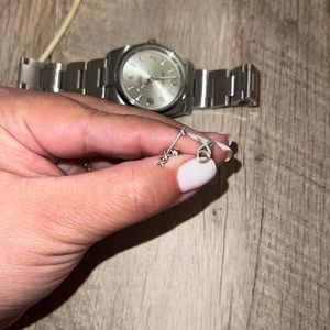 Tiffany & Co earrings. One arrow one XO. These are sold separately in store.